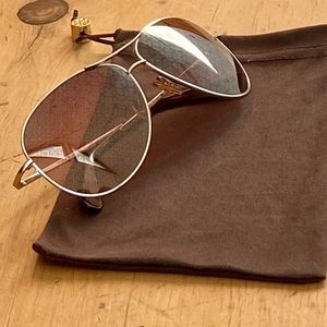 Tory Burch aviator sunglasses with unique logo lens
